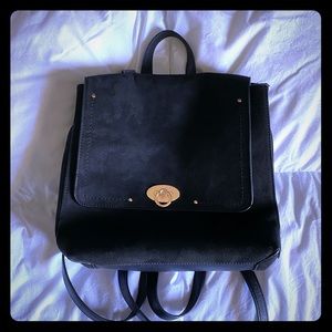 Black faux leather and suede purse backpack